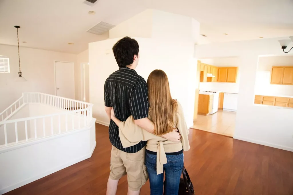 a couple in their first year of marriage looking at their new house