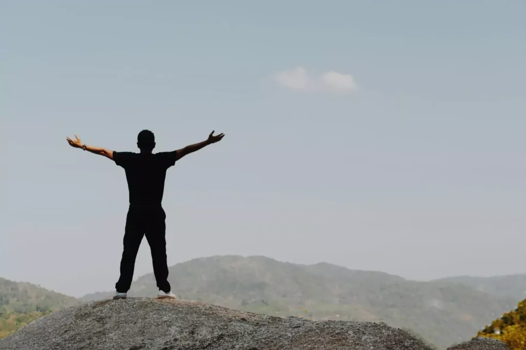 a man with his arms outstretched - free from pornography addiction