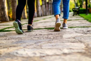 two women walking away avoiding the lust of people looking at them