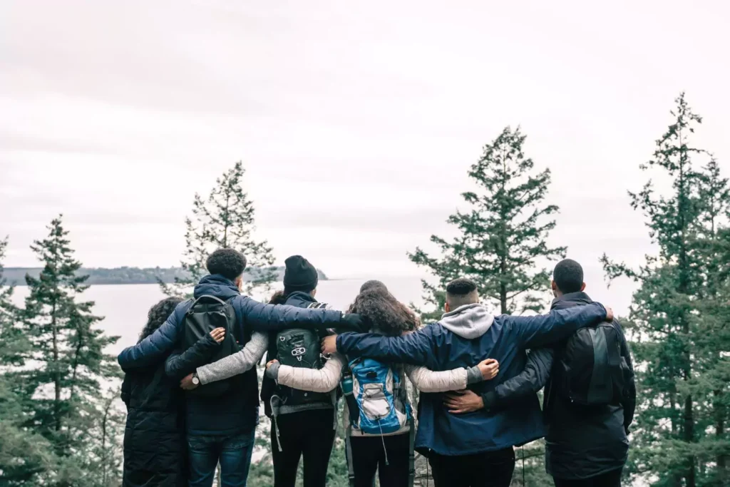 a group of young people serving their community